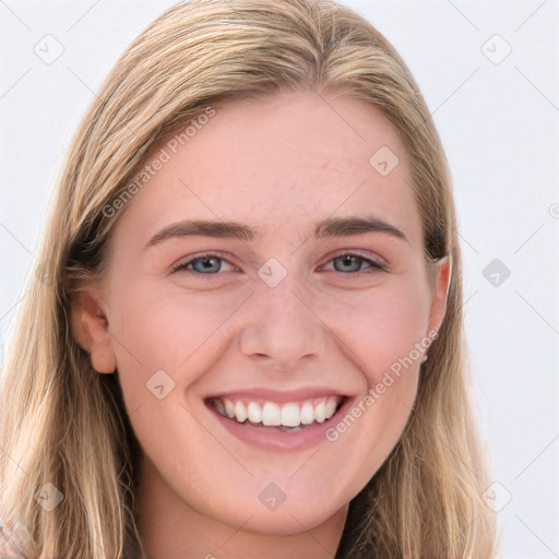 Joyful white young-adult female with long  brown hair and blue eyes