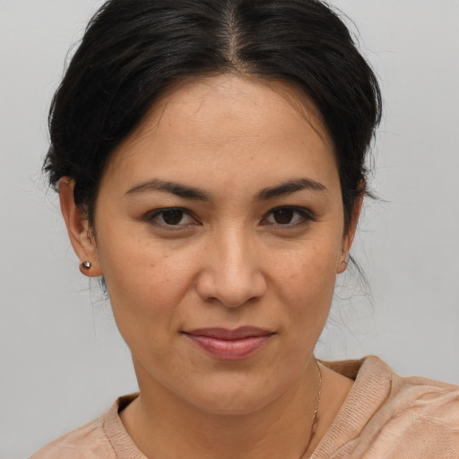 Joyful asian young-adult female with medium  brown hair and brown eyes