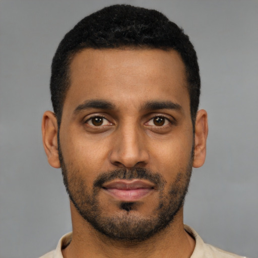 Neutral black young-adult male with short  black hair and brown eyes