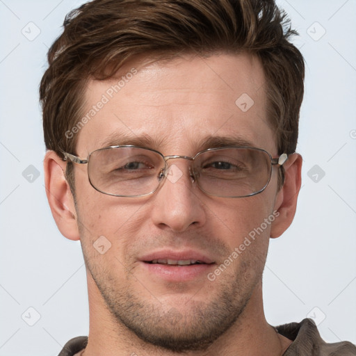 Joyful white adult male with short  brown hair and grey eyes