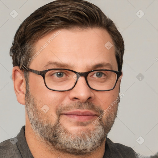 Joyful white adult male with short  brown hair and grey eyes