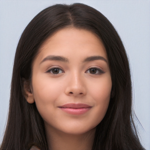 Joyful latino young-adult female with long  brown hair and brown eyes