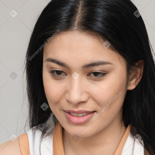 Joyful asian young-adult female with long  brown hair and brown eyes