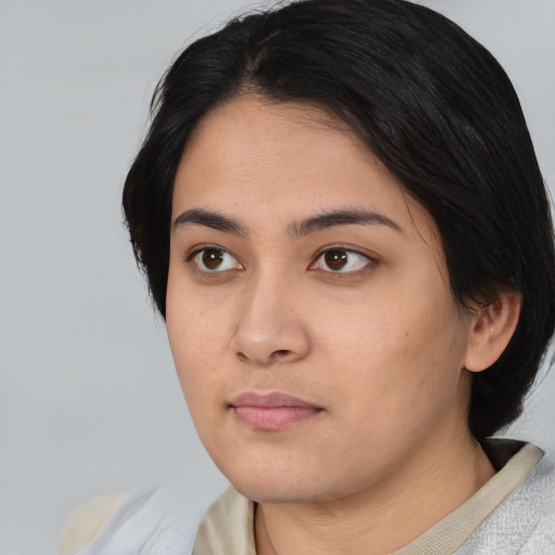 Neutral asian young-adult female with medium  black hair and brown eyes