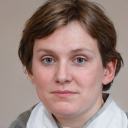 Joyful white young-adult female with medium  brown hair and blue eyes