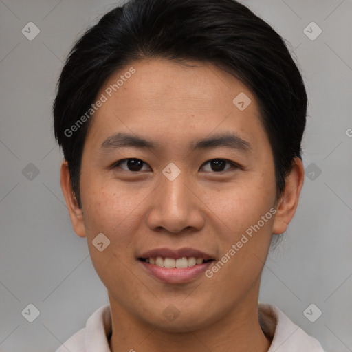 Joyful asian young-adult male with short  brown hair and brown eyes