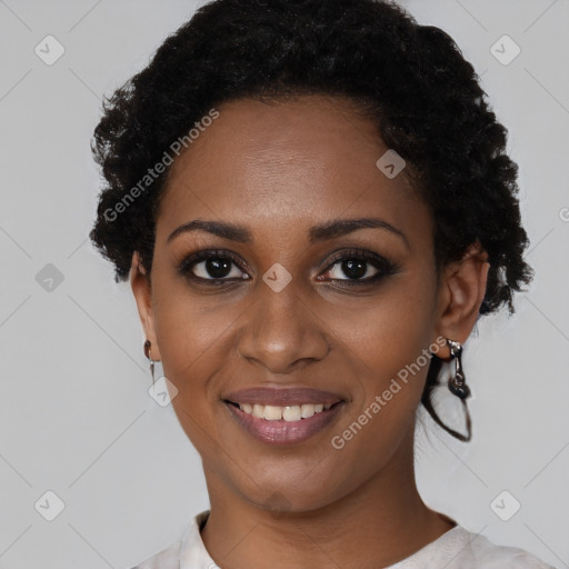 Joyful black young-adult female with short  black hair and brown eyes