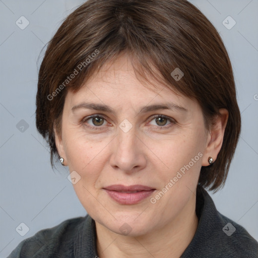 Joyful white adult female with medium  brown hair and grey eyes