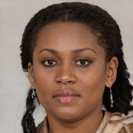 Neutral black young-adult female with long  brown hair and brown eyes