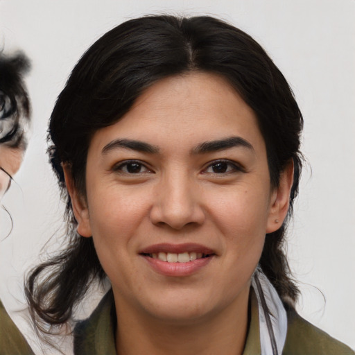 Joyful asian young-adult female with medium  brown hair and brown eyes