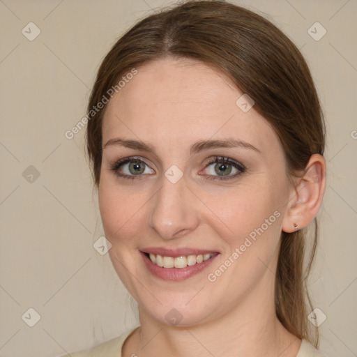 Joyful white young-adult female with medium  brown hair and green eyes