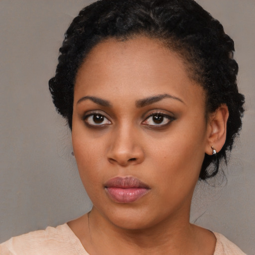 Neutral black young-adult female with medium  black hair and brown eyes