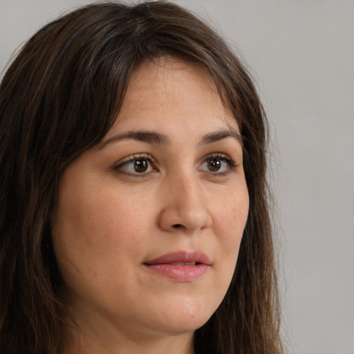 Neutral white young-adult female with long  brown hair and brown eyes