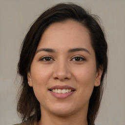 Joyful white young-adult female with medium  brown hair and brown eyes