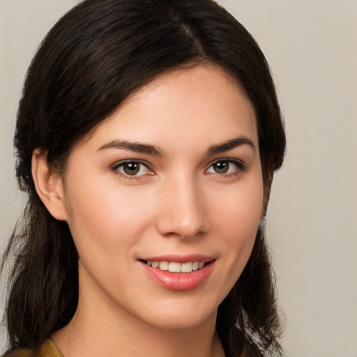 Joyful white young-adult female with medium  brown hair and brown eyes