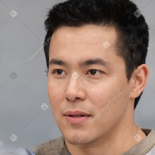 Neutral asian young-adult male with short  black hair and brown eyes