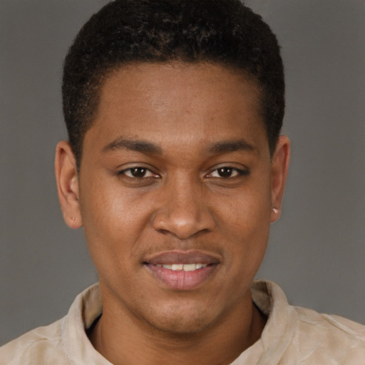Joyful latino young-adult male with short  brown hair and brown eyes
