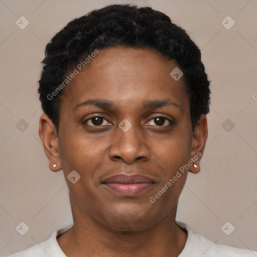 Joyful black young-adult female with short  black hair and brown eyes