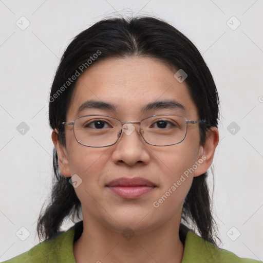 Joyful asian young-adult female with medium  black hair and brown eyes