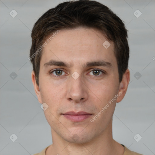 Joyful white young-adult male with short  brown hair and grey eyes