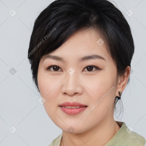 Joyful asian young-adult female with medium  black hair and brown eyes