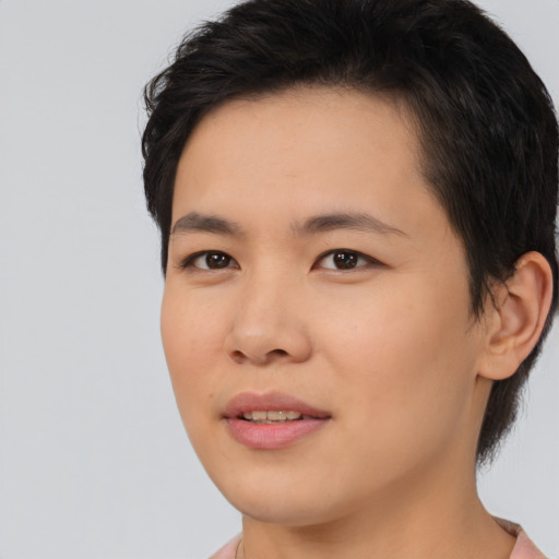 Joyful asian young-adult male with short  brown hair and brown eyes
