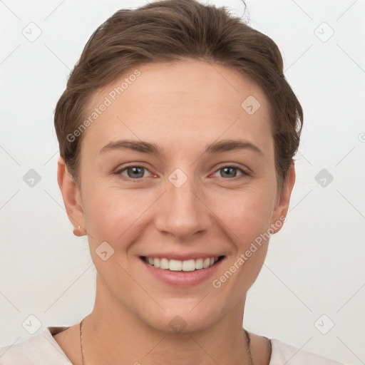 Joyful white young-adult female with short  brown hair and grey eyes