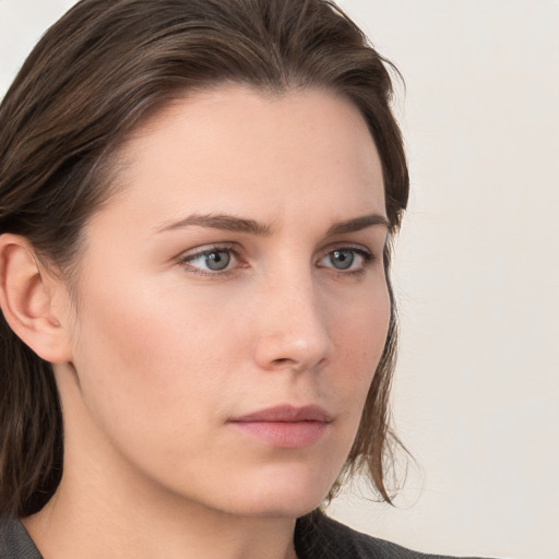 Neutral white young-adult female with long  brown hair and grey eyes