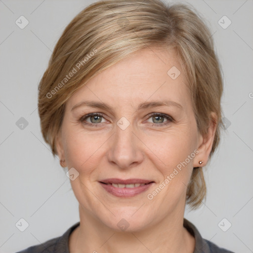 Joyful white adult female with medium  brown hair and grey eyes