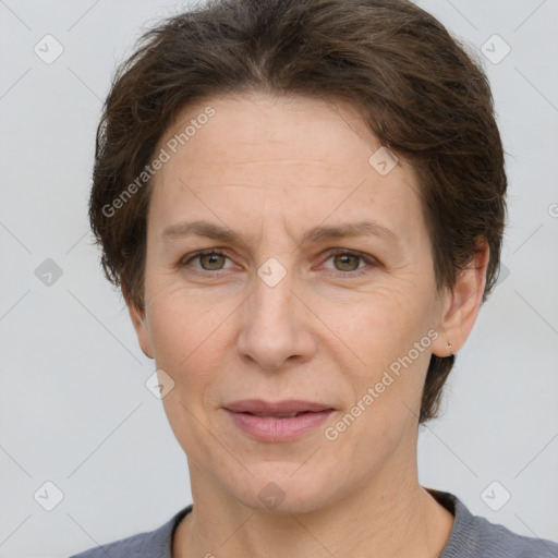 Joyful white adult female with short  brown hair and brown eyes