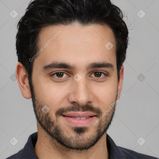 Joyful white young-adult male with short  black hair and brown eyes