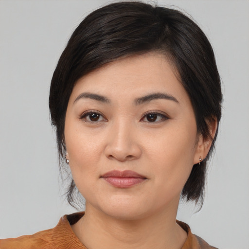Joyful white young-adult female with medium  black hair and brown eyes