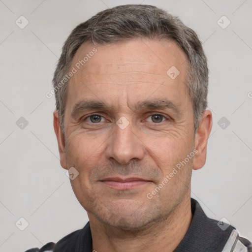 Joyful white adult male with short  black hair and brown eyes