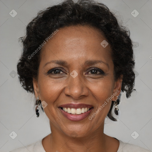 Joyful black adult female with medium  brown hair and brown eyes