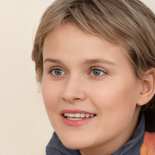 Joyful white young-adult female with medium  brown hair and blue eyes