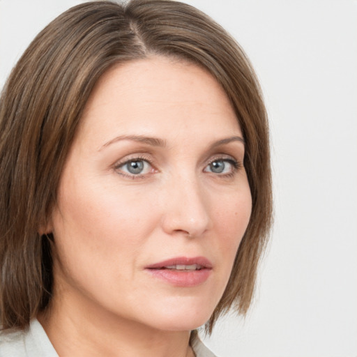 Neutral white young-adult female with medium  brown hair and grey eyes