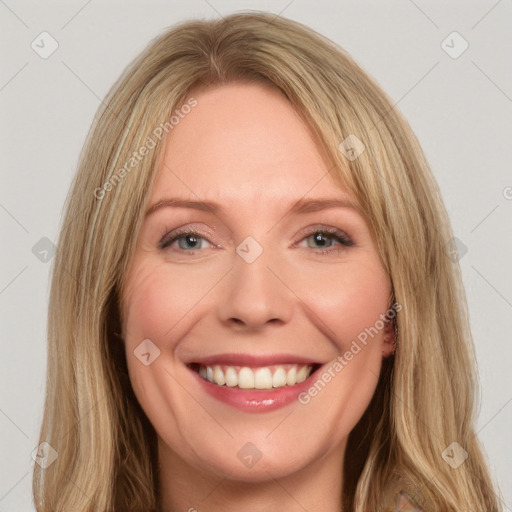 Joyful white young-adult female with long  brown hair and green eyes