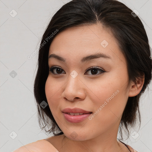 Joyful asian young-adult female with medium  brown hair and brown eyes