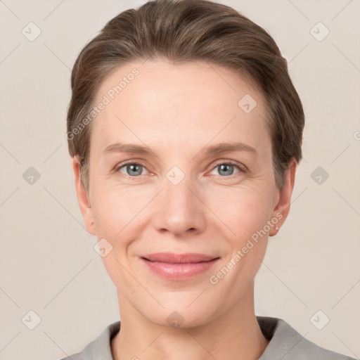 Joyful white adult female with short  brown hair and grey eyes