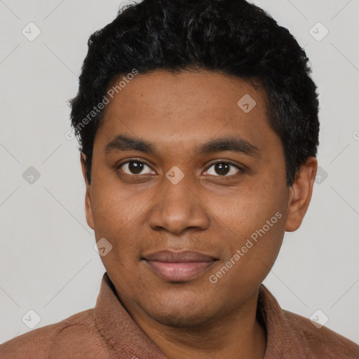 Joyful black young-adult male with short  black hair and brown eyes