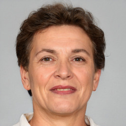 Joyful white adult female with short  brown hair and brown eyes