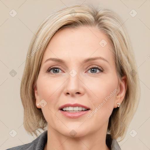 Joyful white adult female with medium  brown hair and grey eyes