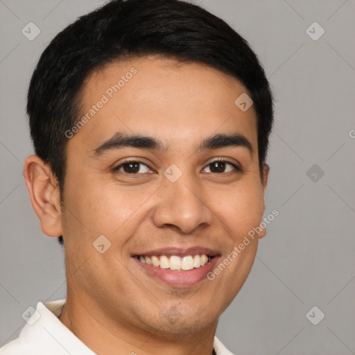 Joyful latino young-adult male with short  brown hair and brown eyes