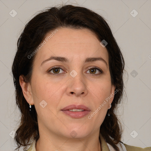 Joyful white adult female with medium  brown hair and brown eyes