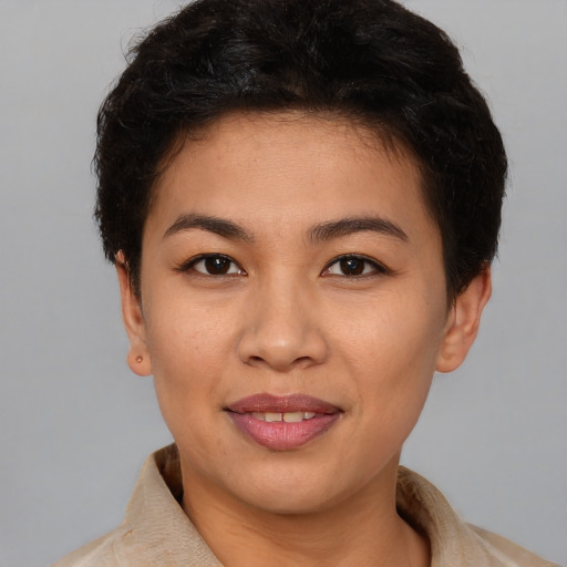 Joyful white young-adult female with short  brown hair and brown eyes