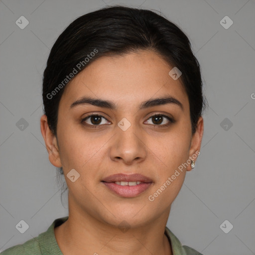 Joyful latino young-adult female with medium  brown hair and brown eyes