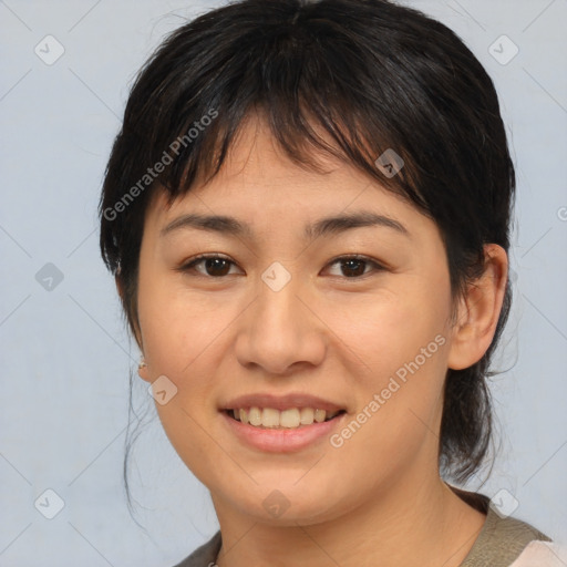 Joyful asian young-adult female with medium  brown hair and brown eyes