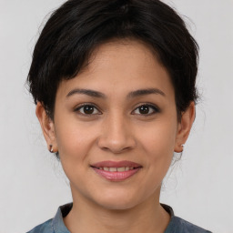 Joyful asian young-adult female with medium  brown hair and brown eyes