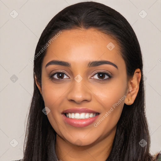 Joyful latino young-adult female with long  black hair and brown eyes