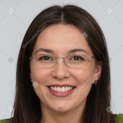 Joyful white adult female with long  brown hair and green eyes